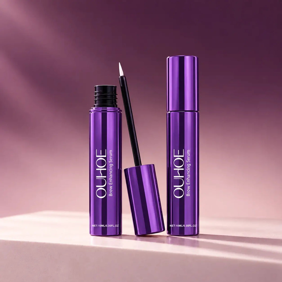 Two purple serum bottles with the fine-tip applicator