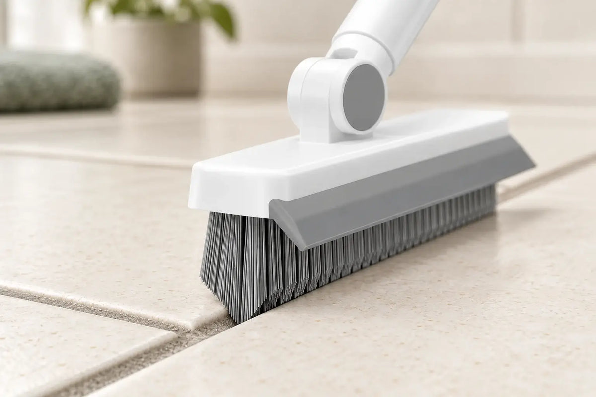 Longer center bristles reaching the recessed grout between tiles