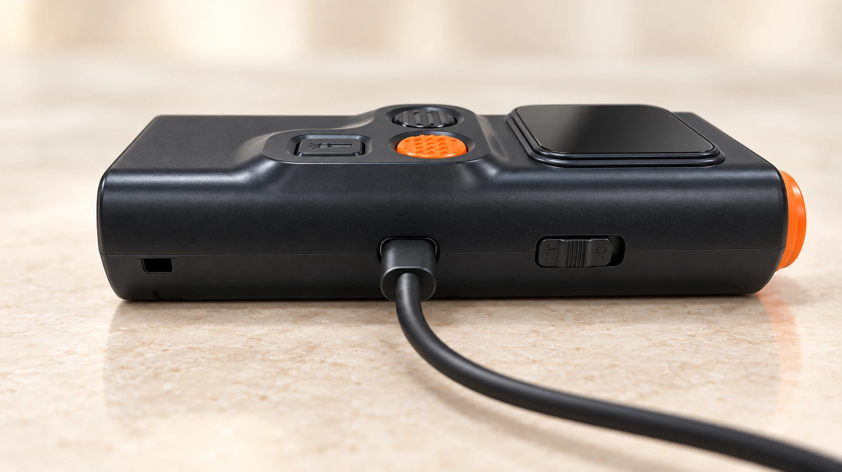 USB-C cable connected to the middle side port of HushVera, with its separate power switch toward the acoustic head.